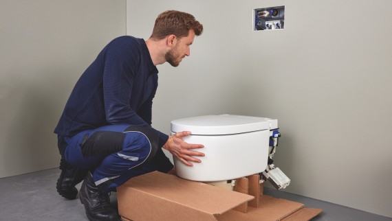 Plumber with Geberit AquaClean Sela