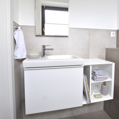 View of the guest bathroom with washbasin and cabinets