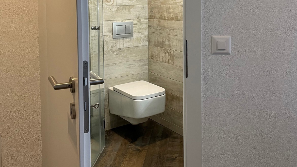 Bathroom door that opens outwards