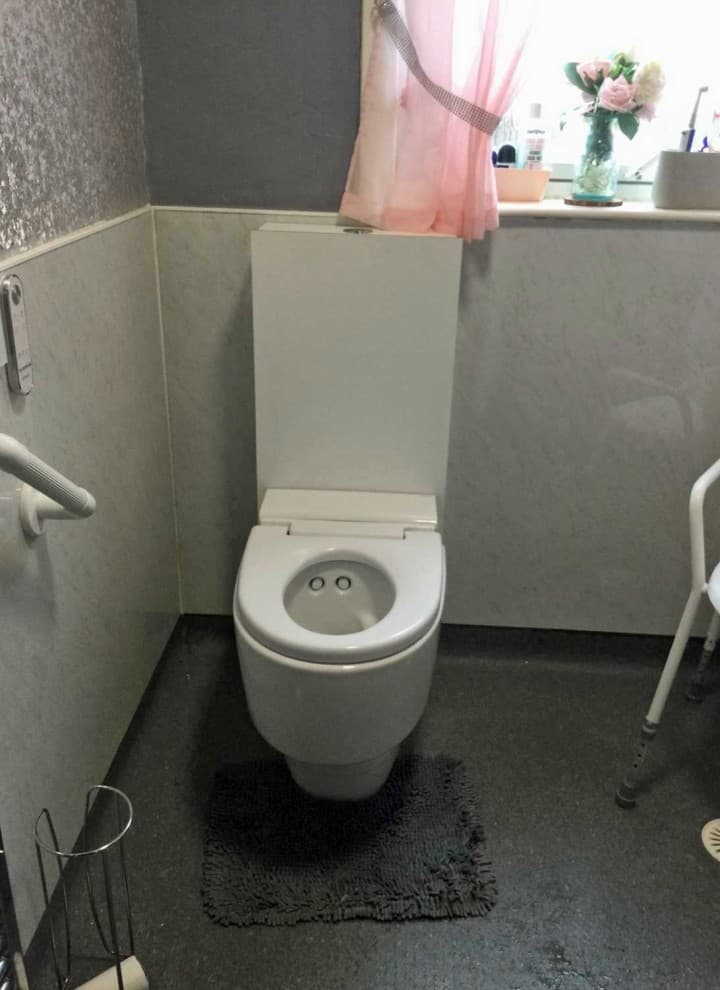 Geberit AquaClean Mera Care wash and dry toilet installed in a private bathroom Geberit AquaClean Mera Care wash and dry toilet installed in a private bathroom