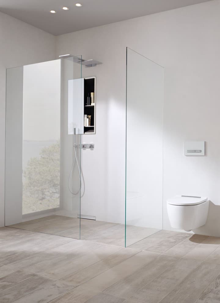 The Geberit ONE walk-in shower panel is anchored in the prewall without any visible fittings and is therefore particularly easy to clean. The Geberit ONE walk-in shower panel is anchored in the prewall without any visible fittings and is therefore particularly easy to clean.